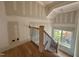 Stairway with wood and iron railings, offering a classic design with hardwood flooring at 627 Georgetown Rd, Raleigh, NC 27608
