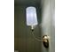 Close-up of a stylish wall sconce, accentuating the detailed craftsmanship and subtle lighting at 627 Georgetown Rd, Raleigh, NC 27608