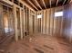 Spacious bedroom with framed walls, windows, and walk-in closet at 208 E Whitaker Mill Rd, Raleigh, NC 27608