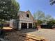 New home construction featuring wood framing and Tyvek wrap, with an unfinished lot at 208 E Whitaker Mill Rd, Raleigh, NC 27608