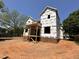 A new home showing brick foundation, wood framing and Tyvek wrap, capturing the construction phase at 208 E Whitaker Mill Rd, Raleigh, NC 27608