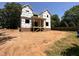 New home with wood framing, brick foundation, and Tyvek house wrap, showcasing its early stage at 208 E Whitaker Mill Rd, Raleigh, NC 27608