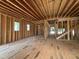 Spacious interior of new construction home featuring unfinished flooring and wooden frame at 208 E Whitaker Mill Rd, Raleigh, NC 27608