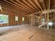 Interior view of framed walls, stairs, and multiple windows providing lots of natural light at 208 E Whitaker Mill Rd, Raleigh, NC 27608