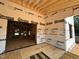 Interior of a new construction home with visible studs and brick foundation wall at 208 E Whitaker Mill Rd, Raleigh, NC 27608