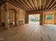 Living room featuring an open floor plan, fireplace, large windows, and outdoor view at 208 E Whitaker Mill Rd, Raleigh, NC 27608