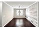 Spacious dining area with hardwood floors and large window at 609 Meadowgrass Ln, Wake Forest, NC 27587