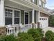 House exterior featuring stone accents and a porch at 609 Meadowgrass Ln, Wake Forest, NC 27587