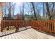 Outdoor deck with wooden railings, offering a perfect space for outdoor relaxation and entertaining at 6413 English Oaks Dr, Raleigh, NC 27615