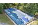 Outdoor basketball court surrounded by trees and a secure fence at 6413 English Oaks Dr, Raleigh, NC 27615