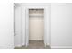 Bedroom closet with bi-fold doors, neutral paint and wire shelving at 6413 English Oaks Dr, Raleigh, NC 27615