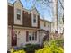 Charming multi-story home with dormer windows, red shutters, and mature landscaping at 6413 English Oaks Dr, Raleigh, NC 27615