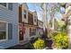 Inviting townhome with dormer windows, well-maintained landscaping, and American flags at 6413 English Oaks Dr, Raleigh, NC 27615