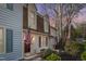 Charming two-story home with manicured landscaping and patriotic American flags on display at 6413 English Oaks Dr, Raleigh, NC 27615