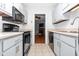 Updated kitchen with neutral counters and cabinets, open to the living area at 6413 English Oaks Dr, Raleigh, NC 27615