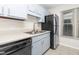 Kitchen featuring stainless steel appliances, tile floors, double sink, and blue cabinets at 6413 English Oaks Dr, Raleigh, NC 27615