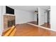 Spacious living room features wood floors, brick fireplace, and neutral paint at 6413 English Oaks Dr, Raleigh, NC 27615