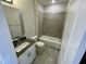 Clean bathroom with gray tile and vanity at 2103 Lambert Rd # 62, Cary, NC 27519