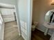 Small powder room with single sink vanity, toilet, and mirror at 2103 Lambert Rd # 62, Cary, NC 27519
