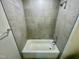 Clean bathroom with gray tile and shower/tub combo at 2103 Lambert Rd # 62, Cary, NC 27519