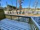 Snow-covered deck overlooks a wooded area with road view at 2103 Lambert Rd # 62, Cary, NC 27519