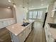 Open concept kitchen with large island, stainless steel appliances, and hardwood floors at 2103 Lambert Rd # 62, Cary, NC 27519