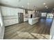 Open concept kitchen with white cabinets and island at 2103 Lambert Rd # 62, Cary, NC 27519