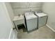 Laundry room with washer, dryer, and utility sink at 2103 Lambert Rd # 62, Cary, NC 27519