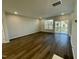 Spacious living room with hardwood floors and access to balcony at 2103 Lambert Rd # 62, Cary, NC 27519