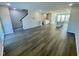 Open concept living room with hardwood floors and kitchen views at 2103 Lambert Rd # 62, Cary, NC 27519