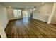 Spacious living room with hardwood floors and sliding glass door to deck at 2103 Lambert Rd # 62, Cary, NC 27519