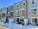 Rear view of townhouses with balconies and snow at 2103 Lambert Rd # 62, Cary, NC 27519