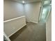 Upstairs hallway with carpet and access to bedrooms at 2103 Lambert Rd # 62, Cary, NC 27519