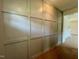 Hallway featuring accent wall and wood floors at 235 Grand Griffon Way, Lillington, NC 27546