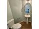 Powder room with pedestal sink and wood floor at 235 Grand Griffon Way, Lillington, NC 27546