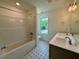 Bathroom featuring a tub and shower combination and a double sink vanity at 235 Grand Griffon Way, Lillington, NC 27546