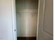 Walk-in closet showing white wire shelving and dark carpeting at 235 Grand Griffon Way, Lillington, NC 27546