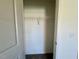Walk-in closet with white wire shelving and beige carpeting at 235 Grand Griffon Way, Lillington, NC 27546