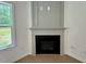Living room fireplace with classic mantel at 235 Grand Griffon Way, Lillington, NC 27546