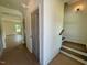 Inviting foyer with wood floors, neutral walls, and staircase access at 235 Grand Griffon Way, Lillington, NC 27546