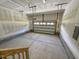 A spacious two-car garage with concrete flooring at 235 Grand Griffon Way, Lillington, NC 27546