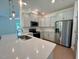 Kitchen island featuring pendant lighting and white cabinets at 235 Grand Griffon Way, Lillington, NC 27546