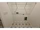 Bright laundry room featuring modern flooring and essential utility connections at 235 Grand Griffon Way, Lillington, NC 27546