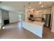Open-concept space featuring living room and kitchen at 235 Grand Griffon Way, Lillington, NC 27546
