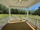 Covered porch with wooded view at 235 Grand Griffon Way, Lillington, NC 27546