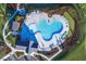 Stunning aerial view of community pool with inviting lounge areas and meticulously maintained landscaping at 1170 Holding Village Way, Wake Forest, NC 27587