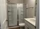 Bathroom with a glass enclosed shower, gray walls, white vanity and tile flooring at 1170 Holding Village Way, Wake Forest, NC 27587