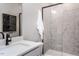 Modern bathroom featuring a glass-enclosed shower, sleek sink, and decorative wall art at 1170 Holding Village Way, Wake Forest, NC 27587