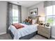 Inviting bedroom with soft carpet, cozy bedding, and natural light from the window with striped curtains at 1170 Holding Village Way, Wake Forest, NC 27587