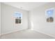 Bedroom with two large windows providing natural light and a view of the trees at 1170 Holding Village Way, Wake Forest, NC 27587